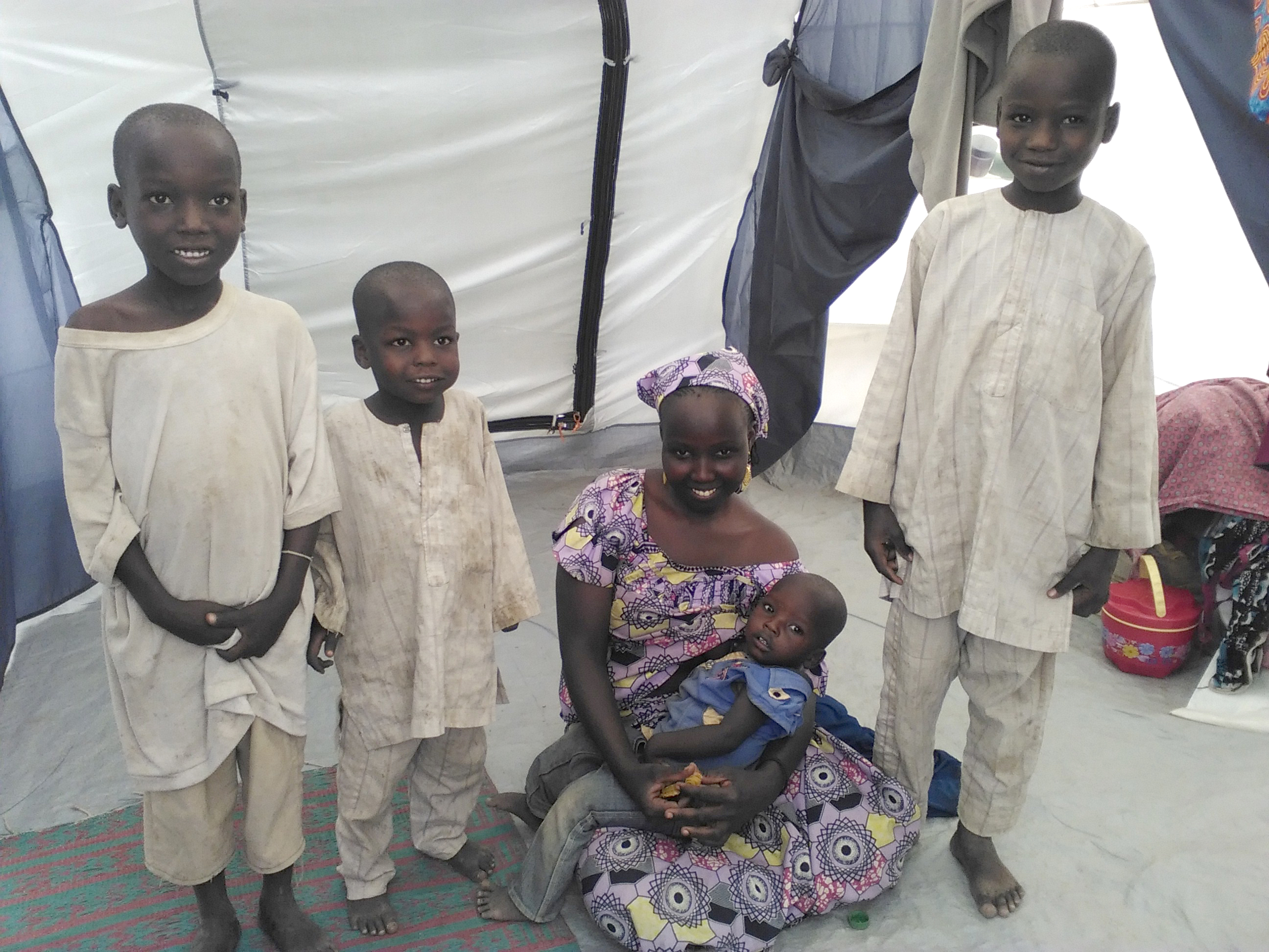 Recipients of ShelterBox aid inside their tent in Cameroon