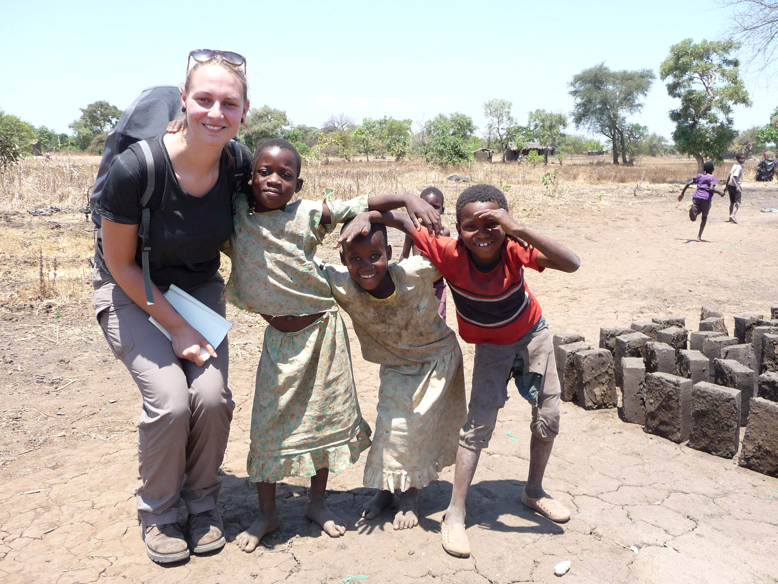 A ShelterBox response team member with recipients of our essential aid and emergency shelter