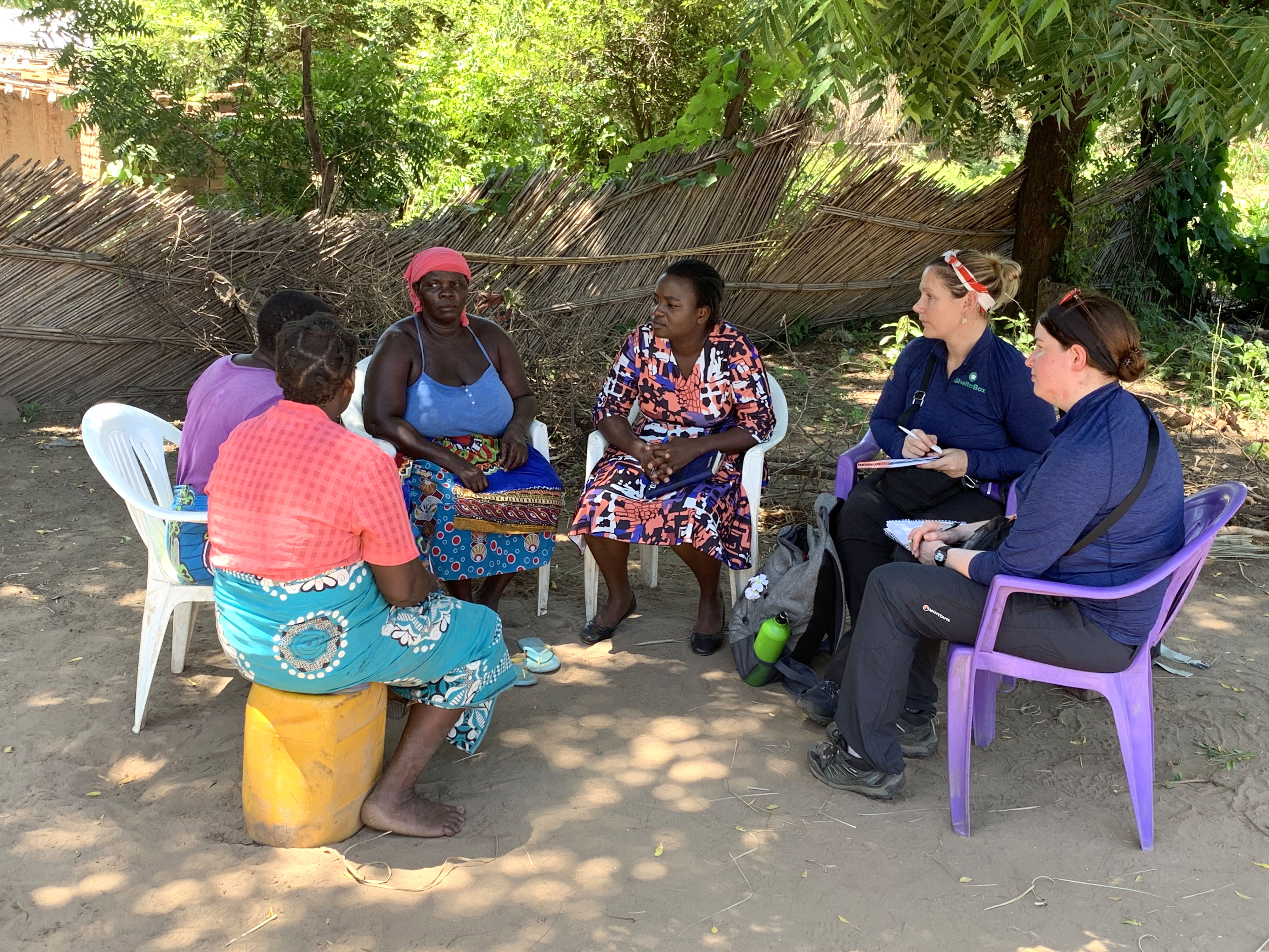 ShelterBox Response Team Members talk with women in Malawi to understand their needs