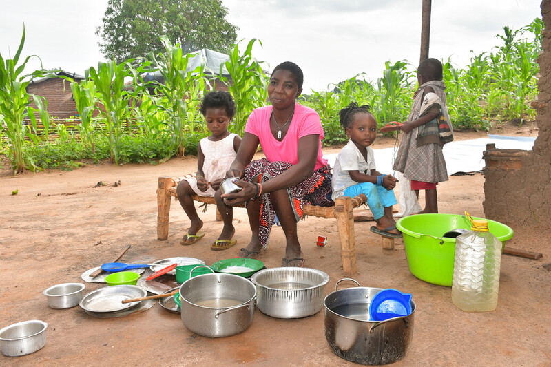 Mozambique family with kitchen set provided by ShelterBox
